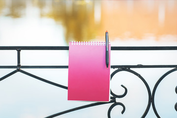Fototapeta premium lake railing with spiral notepad