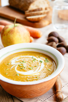 Carrot, Parsnip and Chestnut Bisque, garnished with soy yogurt and chives