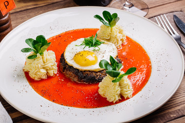 Red Beefsteak with egg and potatoes