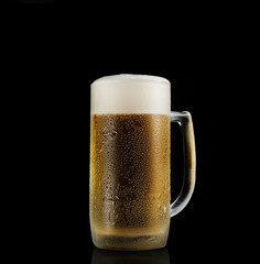 Pint of beer on black  background