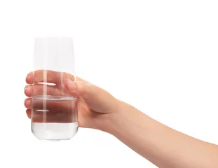 Fotobehang Female hand holding clean drinking glass with water © IntelWond