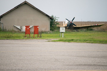 Old propeller driven airplanes at the end of runway