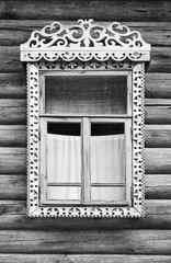 Window with carved wooden frame