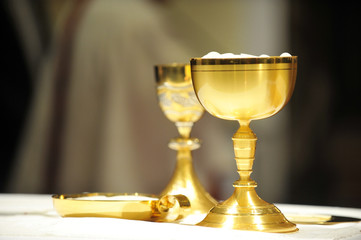 Golden chalices on the altar.