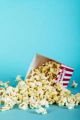 Popcorn bucket against a blue background