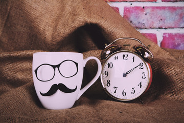 Coffee cup with a black hipster mustache  Vintage Retro Filter.