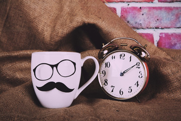 Coffee cup with a black hipster mustache  Vintage Retro Filter.
