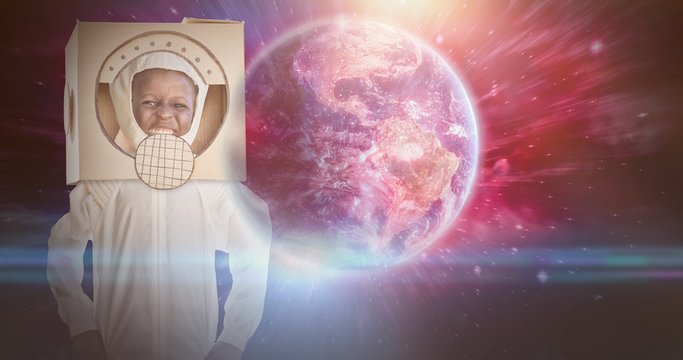 Composite image of boy is dessing up as an astronaut