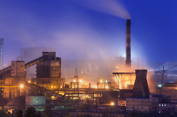 Metallurgical plant at night. Steel factory with smokestacks. Steelworks, iron works. Heavy...
