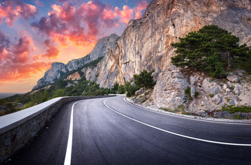 Asphalt road. Colorful landscape with beautiful winding mountain road with a perfect asphalt with...