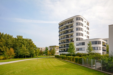 Modern residential tower, apartment building in a new urban development - 121872858