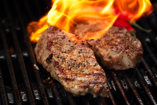 Pork Steak On Bbq Grill With Flame