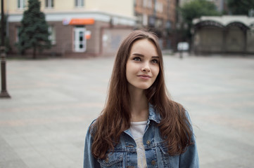Fototapeta premium portrait of a beautiful girl closeup on street