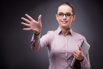 Businesswoman pressing virtual button in business concept
