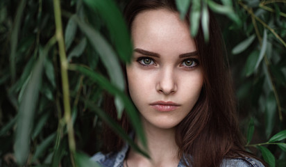 Fototapeta premium portrait of a beautiful girl closeup on street