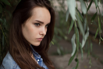 Naklejka premium portrait of a beautiful girl closeup on street