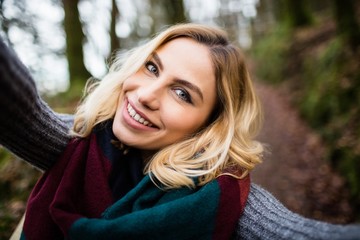 Close-up of smiling woman in forest