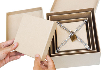 Opening secret boxes with the last one chained and lock / Secret and puzzle concept