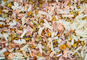 Assorted frozen seafood coctail, view from top, fits as background
