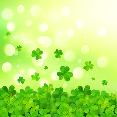 Light green vector background with clovers and bokeh effect