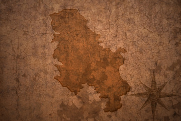 serbia map on vintage crack paper background