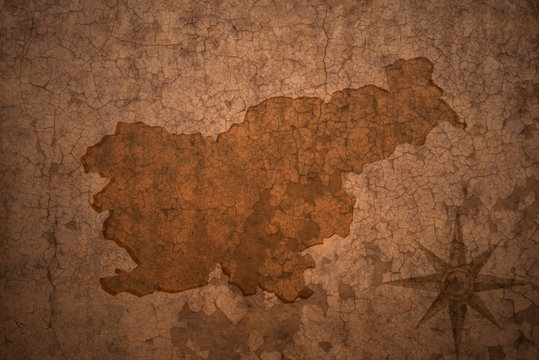 slovenia map on vintage crack paper background