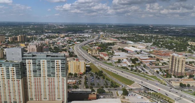 An aerial view over the skyline of San Antonio, Texas and Interstate 37.  	