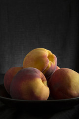 Fototapeta na wymiar Healthy fresh peaches in a bowl