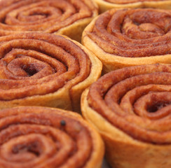 A Background of Store Bought Cinnamon Roll Cakes