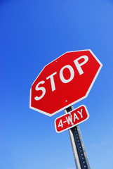 stop sign against blue sky