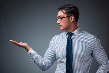 Handsome businessman pressing virtual buttons