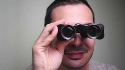 Man looking trough some old vintage binocular. - Powered by Adobe