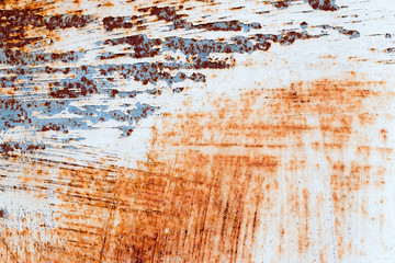 A background of peeling paint and rusty old metal