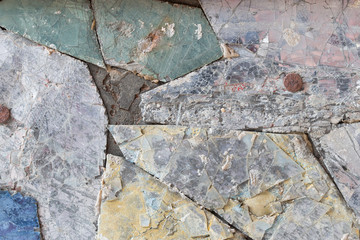 Colorful old stone mosaic on the wall.