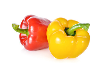 fresh red, yellow bell pepper with stem on white background