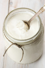 Fototapeta na wymiar Sour cream in jar