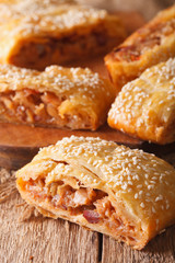 sliced pie with cabbage and sausages macro. vertical
