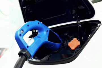 Obraz na płótnie Canvas Electric car charger at the station, closeup
