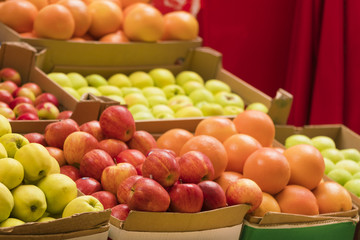 Counter with fruit in wooden boxes, background