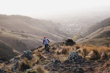 Mountain Biker Looking Out Over City