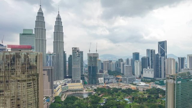 Cloudscape aerial view of Kuala Lumpur city skyline. Time lapse. Zoom out