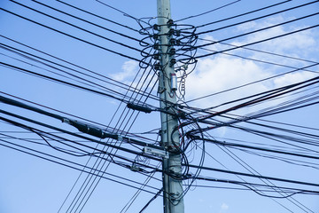 electricity pole with electricity wire in blue sky background