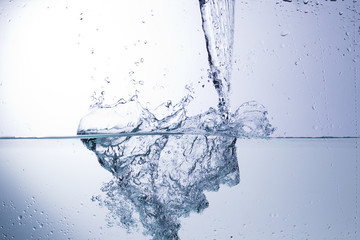 Clear water on a monochromatic background, abstraction