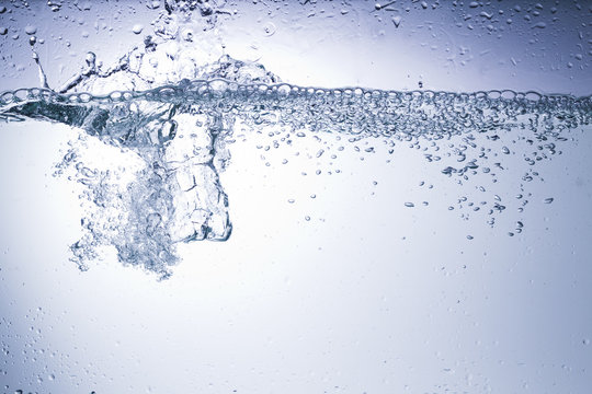 Clear water on a monochromatic background, abstraction