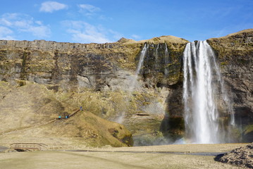 Beautiful  Seljalandsfoss waterfall with river and meadow  in Iceland