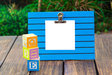 White note paper on a blue holder