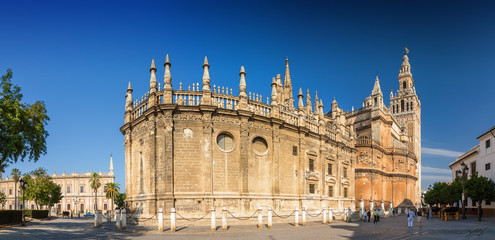 Fototapeta na wymiar Sunny panoramic view of Cathedral and Giralda in Sevilla, Andalusia province, Spain.