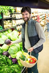 Portrait of man buying vegetables in organic shop
