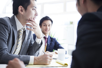 Young businessmen who have a discussion