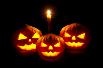 Pumpkin, Halloween pumpkin lantern, Pumpkin jack o lantern shiny head with the candlestick on black background.